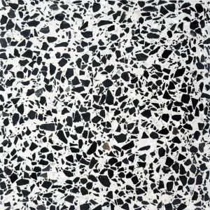 Dalle terrazzo Carodeco avec fond blanc et éclats noirs contrastés, style contemporain